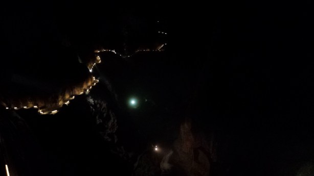 The lit up path in the massive cavern