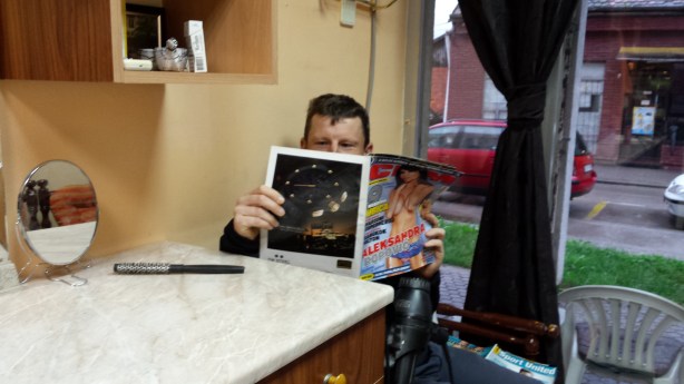 Browsing the reading material at the barber